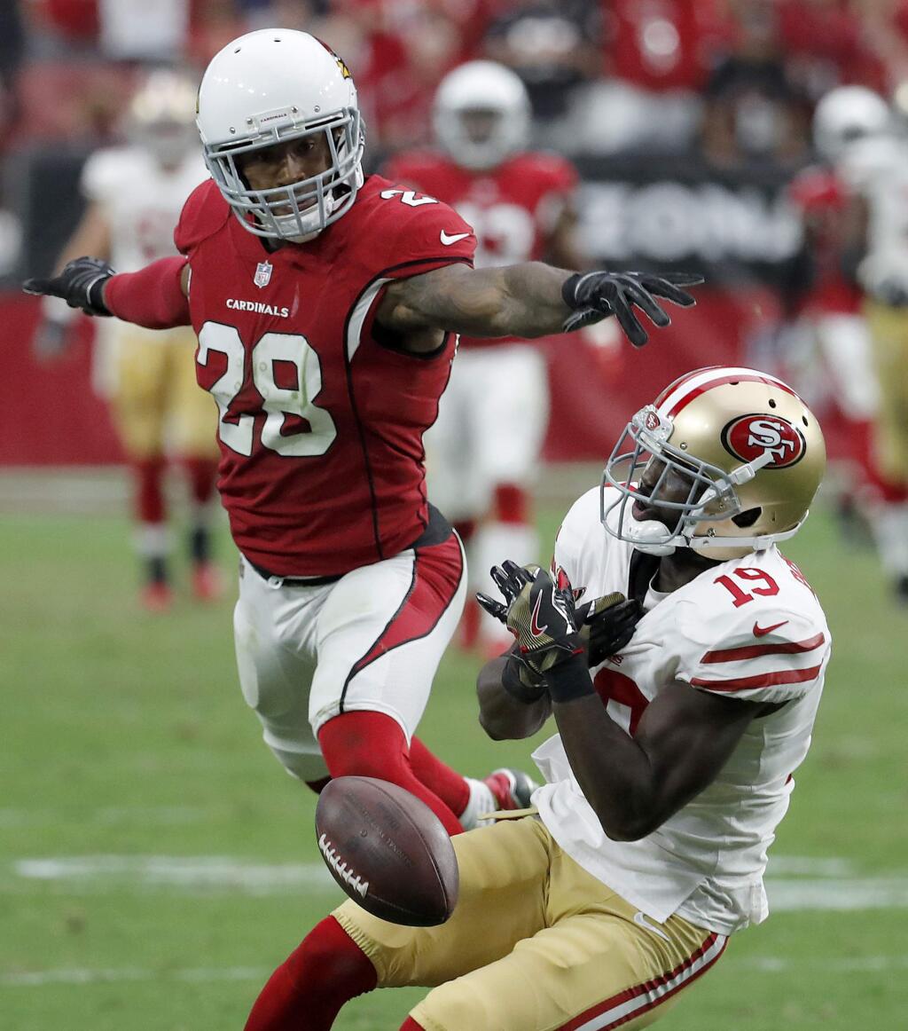 Arizona Cardinals cornerback Justin Bethel breaks up a pass intended for San Francisco 49ers wide receiver Aldrick Robinson during the second half Sunday, Oct. 1, 2017, in Glendale, Ariz. (AP Photo/Rick Scuteri)