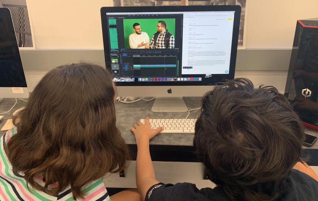 Students work together to edit a video in filmmaking bootcamp class with the Alexander Valley Film Society. (Kathryn Hecht)