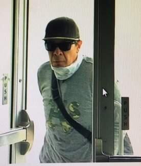 Petaluma police arrested Juan Jose Flores Jr., a 44-year-old Lakeport resident, early Friday morning on suspicion of robbing a Bank of America Wednesday. Police say this surveillance photo shows Flores Jr. entering the bank. (Petaluma Police Department)