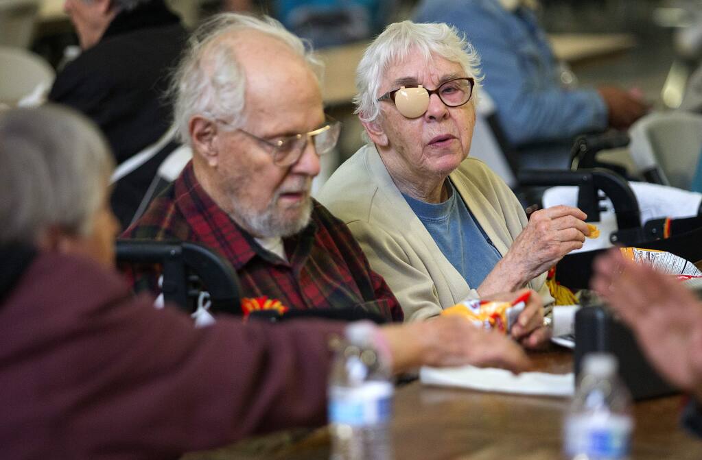 Jerry and Norma Sonosky evacuated their home in Spring Lake Village and joined over 400 other evacuees in the Red Cross shelter at the Sonoma County Fairgrounds on Tuesday. (photo by John Burgess with Helico/The Press Democrat)