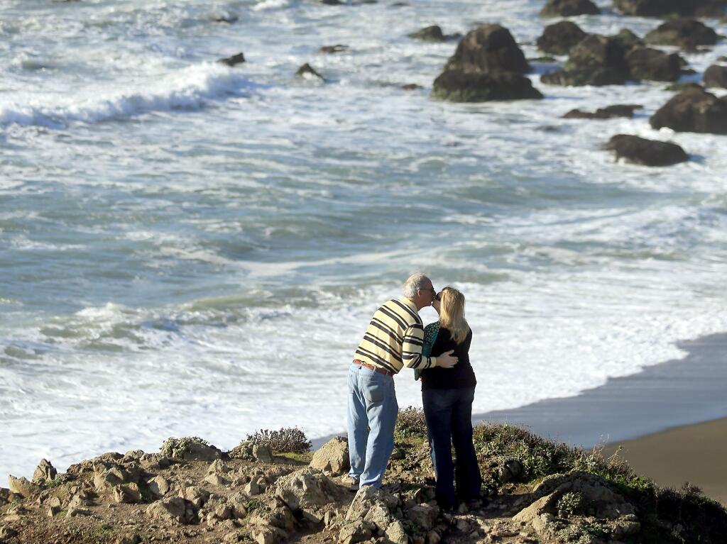 Sonny and Kayla McCauley of Albany, Texas smooch with a view of the Sonoma Coast, north of Bodega Bay in 2015. (KENT PORTER/ PD FILE)