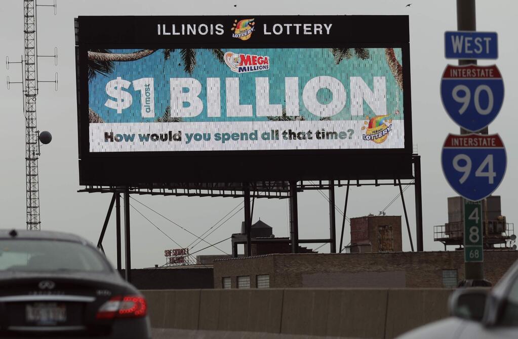 A digital billboard along I-90/94 highway in Chicago, displays the estimated Mega Millions jackpot, Friday, Oct. 19, 2018. Friday's jackpot has soared to $1 billion, the second-largest prize in U. S. lottery history. (AP Photo/Nam Y. Huh)