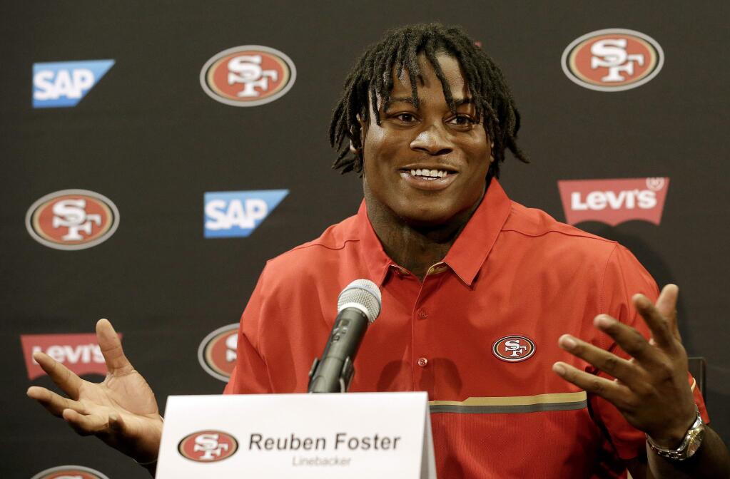 San Francisco 49ers draft pick Reuben Foster answers questions at a news conference Friday in Santa Clara. He didn't want to answer questions about allowing a company that makes vaporizes for tobacoo and marijuana to sponsor his draft party. (JEFF CHIU / Associated Press)