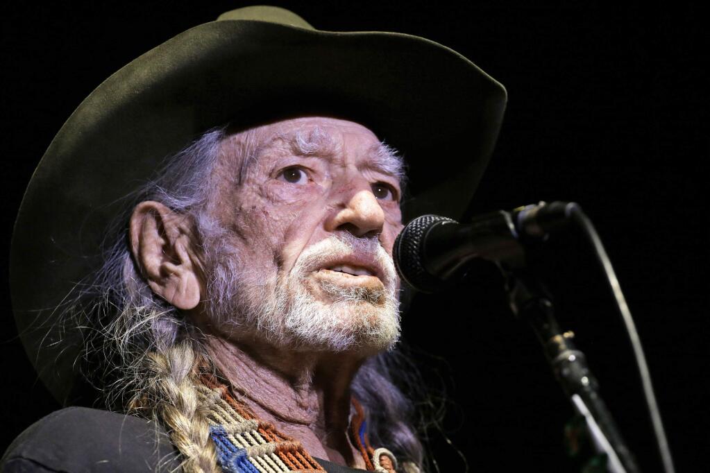FILE - In this Jan. 7, 2017, file photo, Willie Nelson performs in Nashville, Tenn. Nelson's publicist told The Associated Press on March 22, 2017, that the singer is 'perfectly fine' despite reports claiming the country music legend is 'deathly ill' and struggling to breathe. (AP Photo/Mark Humphrey, File)