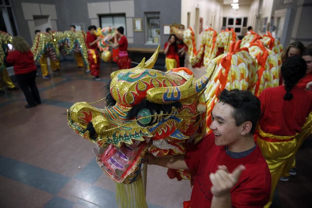 Jonah Musson, 14, waits with a group from Santa Rosa Middle School before performing a dragon dance during a Chinese New Year celebration hosted by the Redwood Empire Chinese Association at the Veterans Memorial Building on Sunday, February 18, 2018 in Santa Rosa, California . (BETH SCHLANKER/The Press Democrat)