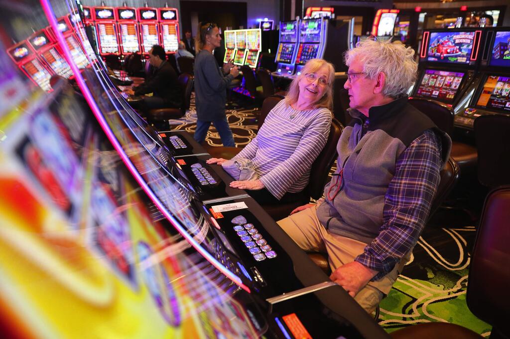 Priscilla and Greg Schelkun, of Petaluma, enjoy gambling in the new enclosed non-smoking section of the Graton Resort & Casino, in Rohnert Park on Tuesday, October 2, 2018. Priscilla Schelkun used to get headaches from the smoke in the casino, and is grateful for the non-smoking area.(Christopher Chung/ The Press Democrat)
