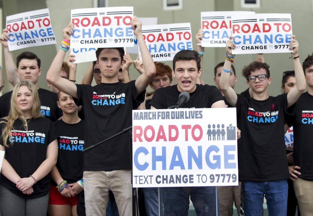 A day after graduating, a group of shooting survivors from Marjory Stoneman Douglas High School announced a summer bus tour to register voters and campaign for gun safety measures. (WILFREDO LEE / Associated Press)