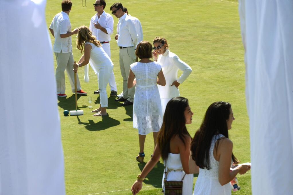 Attendees on the croquet court at the Wishes in Wine Country benefit for Make-A-Wish Greater Bay Area held Saturday at Sonoma-Cutrer Vineyards in Windsor. May 16, 2015. (Photo: Erik Castro/for The Press Democrat)