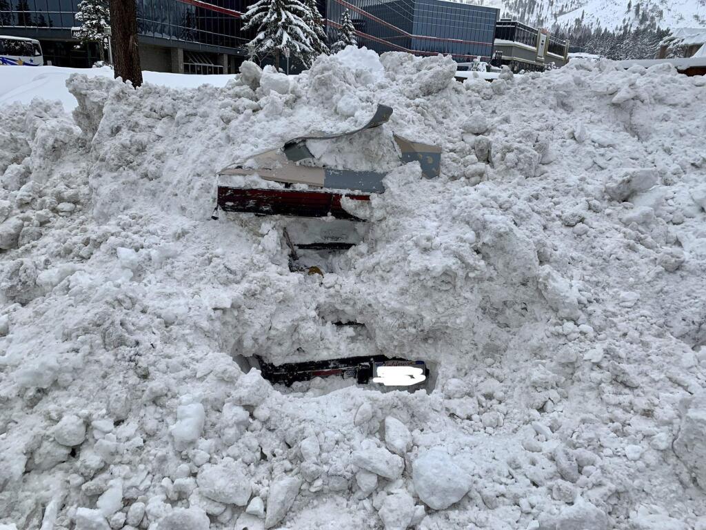 This Feb. 17, 2019 photo provided by City of South Lake Tahoe shows a car buried in snow in South Lake Tahoe, Calif. Authorities say a snowplow operator inadvertently bumped into a car buried in snow and found a woman unharmed inside. Chris Fiore, spokesman for the city of South Lake Tahoe, highlighted the Feb. 17 incident in a Tuesday, Feb. 26 news release in order to urge safety precautions in winter weather. (City of South Lake Tahoe via AP)