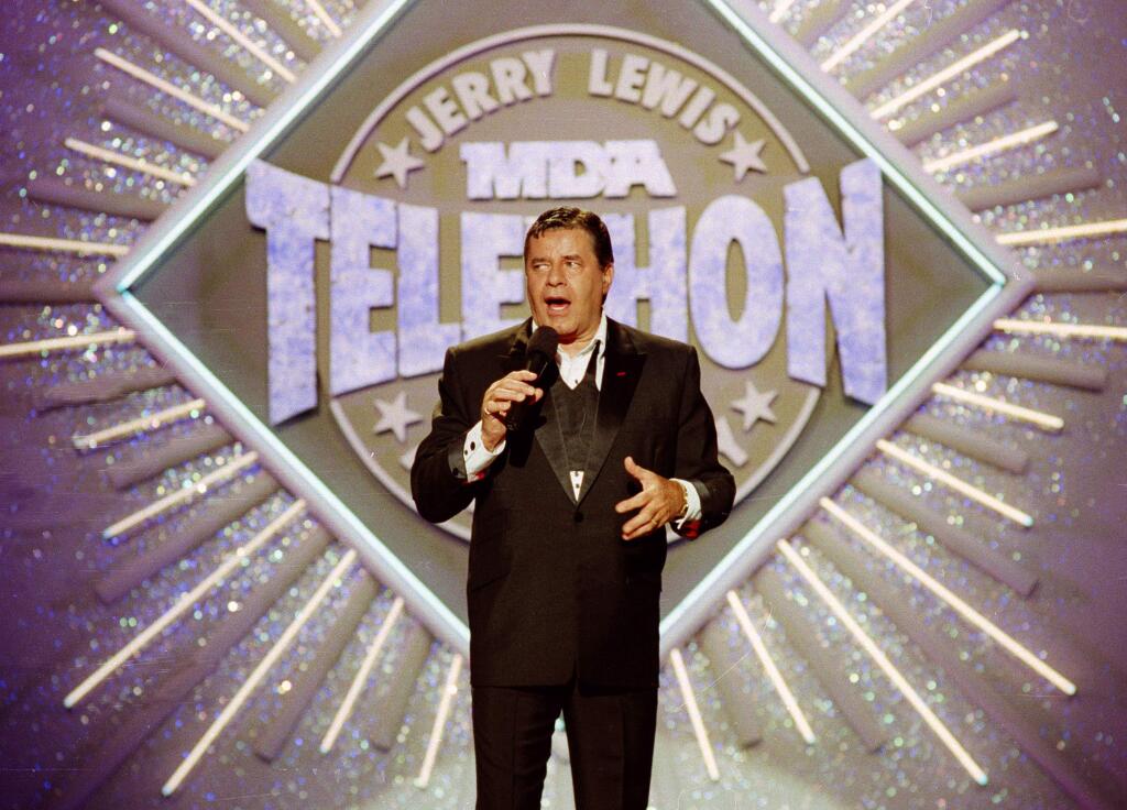 FILE - In this Sept. 2, 1990, file photo, entertainer Jerry Lewis makes his opening remarks at the 25th Anniversary of the Jerry Lewis MDA Labor Day Telethon fundraiser in Los Angeles. Lewis, the comedian whose fundraising telethons became as famous as his hit movies, has died according to his publicist. (AP Photo/Julie Markes, File)