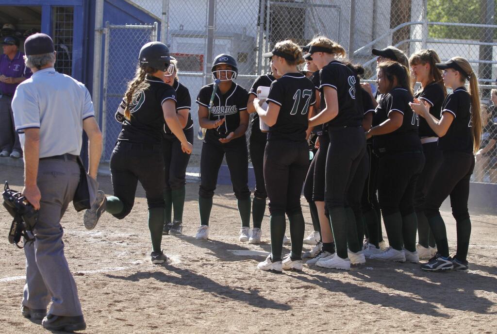 Bill Hoban/Index-TribuneThe Lady Dragons greet Ally Alcayaga at home after she hit a game-tieing home run during Wednesday afternoon's game against Petaluma. Petaluma scored twice in the bottom of the seventh to take a 6-5 win.