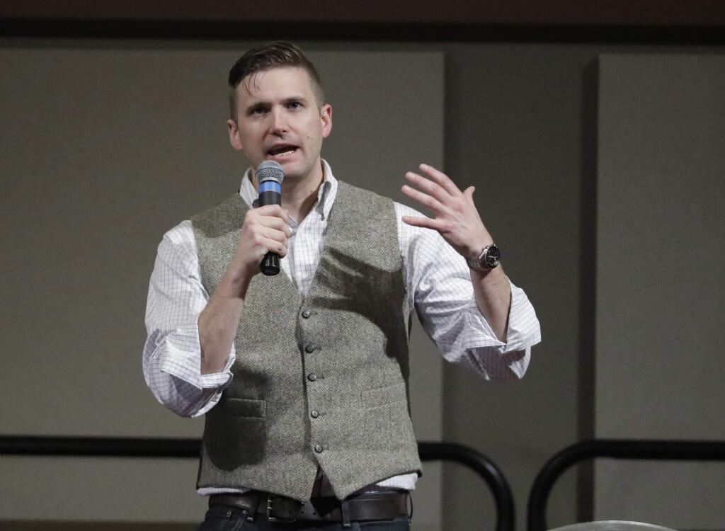 FILE - In this Dec. 6, 2016, file photo, Richard Spencer, who leads a movement that mixes racism, white nationalism and populism, speaks at the Texas A&M University campus in College Station, Texas. A day before Spencer is scheduled to speak at the University of Florida, its President W. Kent Fuchs affirmed Wednesday, Oct. 18, 2017, his belief in free speech but said the security costs of such an event at a public university put an unfair burden on taxpayers. (AP Photo/David J. Phillip, File)