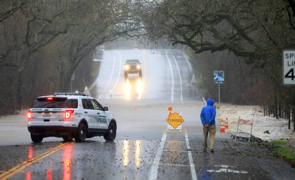 Windsor Road near Mitchell Lance was closed due to flooding early Sunday morning, Jan. 8, 2017. (JOHN BURGESS/ PD)