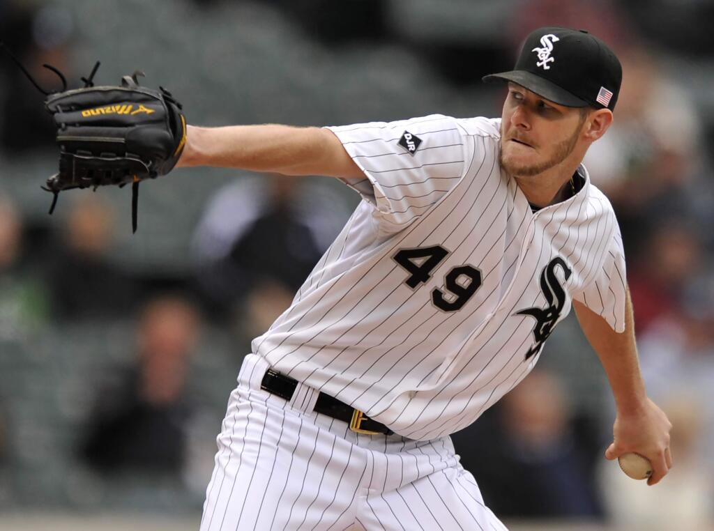 Chicago White Sox starter Chris Sale delivers a pitch during the first inning of a baseball game against the Oakland Athletics in Chicago, Thursday, Sept. 11, 2014. (AP Photo/Paul Beaty)