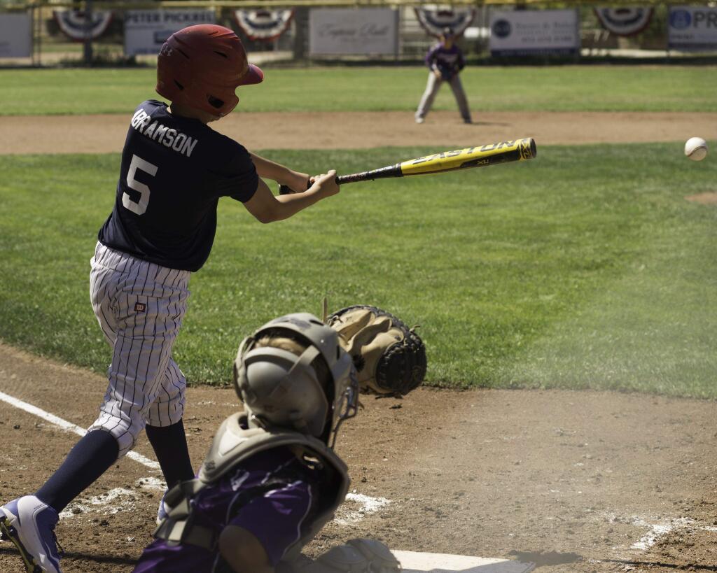 Petaluma Americans' Wyatt Abramson takes a big swing in Northern California Championship Tournament game against Lemoore, won by the Americans, 3-1.(RICH LANGDON PHOTO)