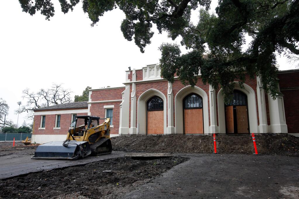 Justin Konninos backs up his compact track sweeper in front of Burbank Auditorium as the nearly 80-year-old building undergoes interior and exterior renovations at Santa Rosa Junior College in Santa Rosa on Wednesday, Jan. 17, 2018. (ALVIN JORNADA/ PD)