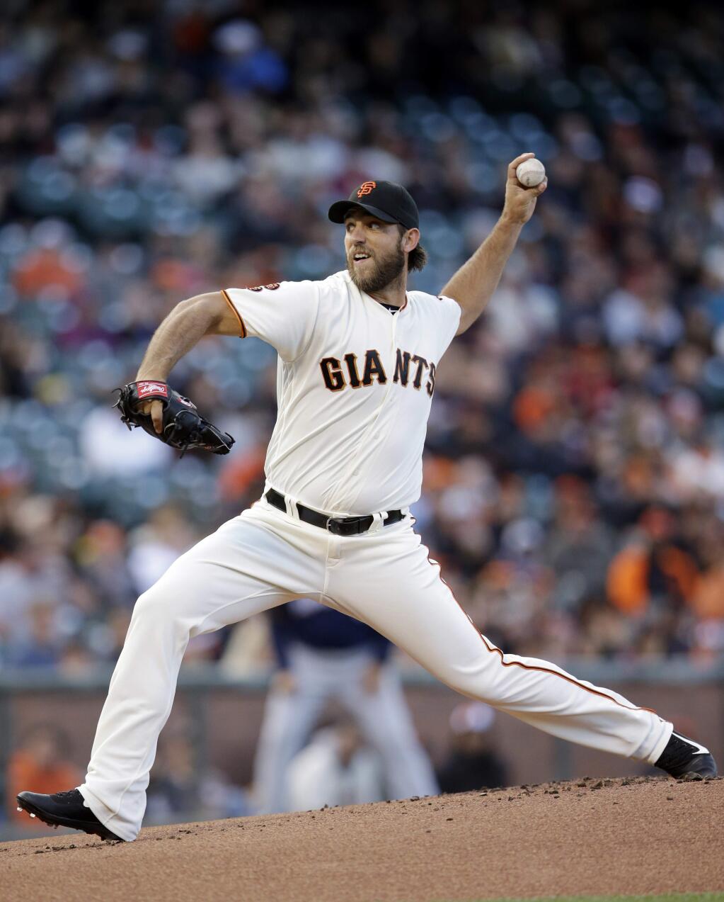 San Francisco Giants starting pitcher Madison Bumgarner throws to the Milwaukee Brewers during the first inning of a baseball game Tuesday, June 14, 2016, in San Francisco. (AP Photo/Marcio Jose Sanchez)