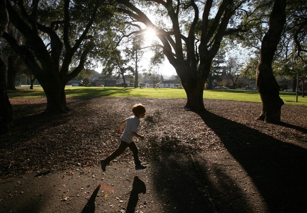 Seven year old Charlie runs on the path at McNear Park in Petaluma on Tuesday, January 20, 2015. (SCOTT MANCHESTER/ARGUS-COURIER STAFF)