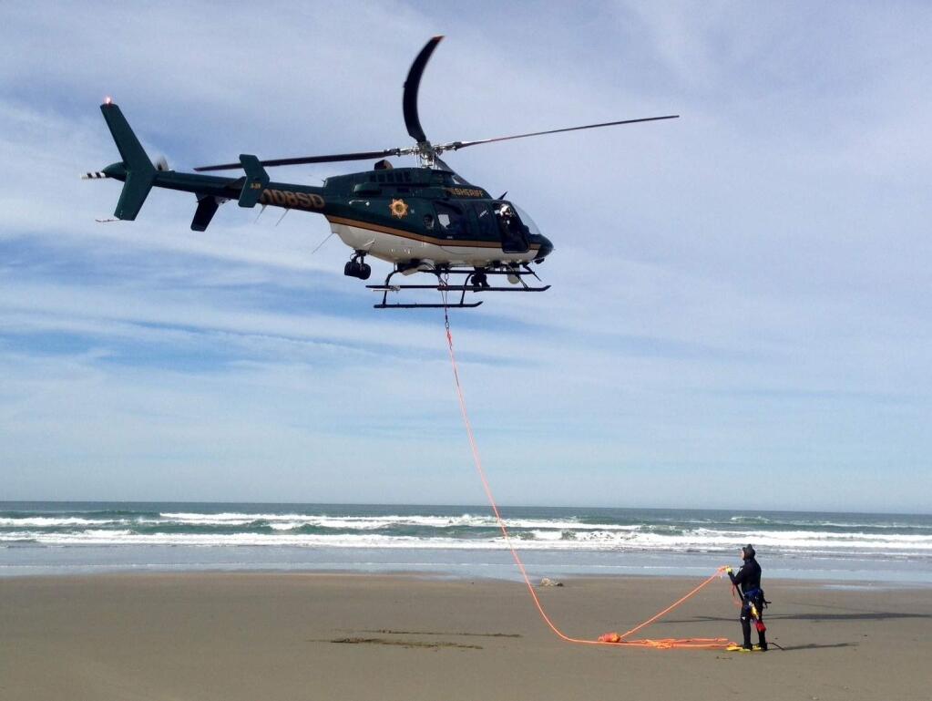 The Henry 1 crew prepares Thursday for a long-line rescue of a surfer off Dillon Beach.