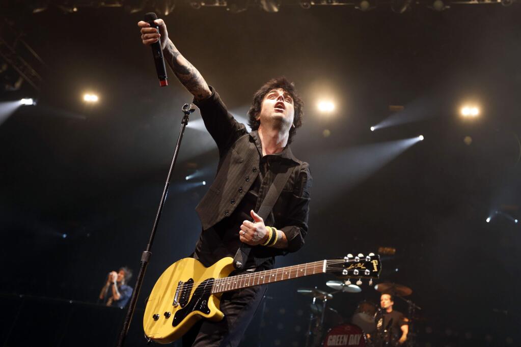FILE - In this Sunday, April 7, 2013, file photo, Billy Joe Armstrong performs during a Green Day concert at the Barclays Center, in New York. The punk trio Green Day, poet of the New York underground Lou Reed and 'Lean on Me' singer Bill Withers will lead a new class of inductees into the Rock and Roll Hall of Fame in 2015. (Photo by Jason DeCrow/Invision/AP, File)