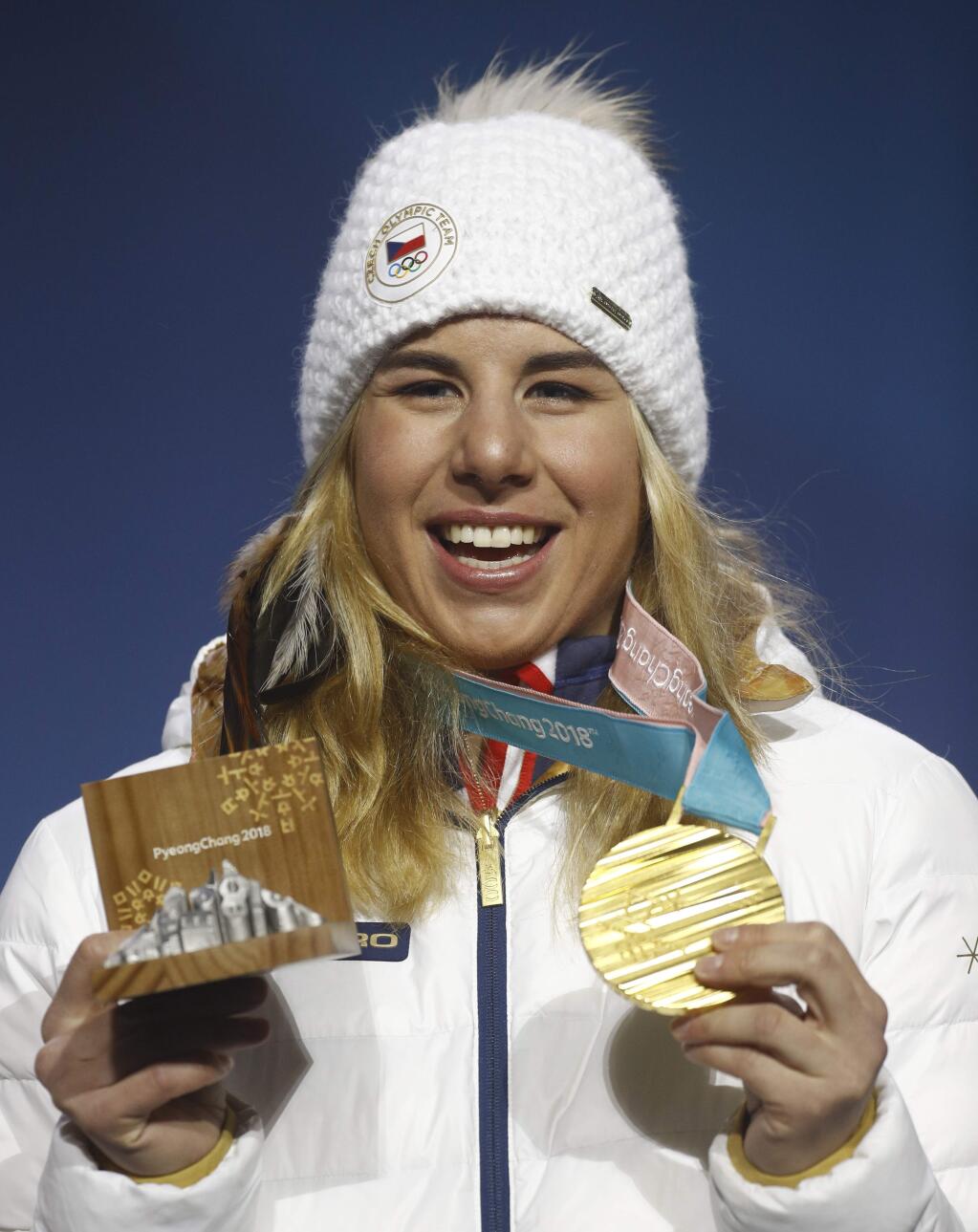 Gold medalist in the women's parallel giant slalom Ester Ledecka, of the Czech Republic, poses during the medals ceremony at the 2018 Winter Olympics in Pyeongchang, South Korea, Saturday, Feb. 24, 2018. (AP Photo/Patrick Semansky)