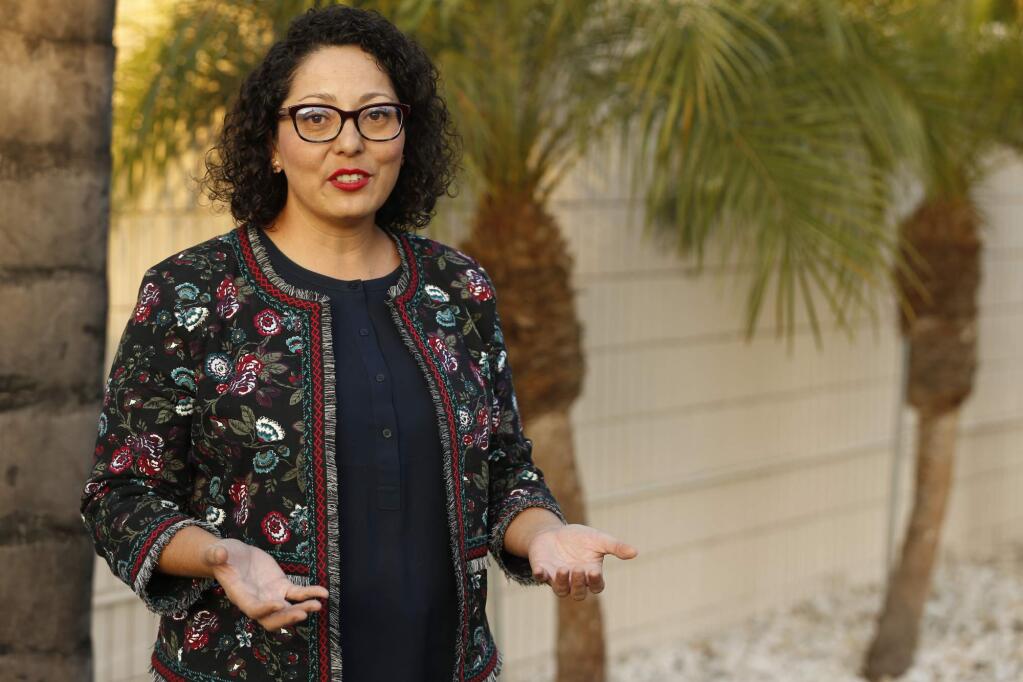 FILE - In this April 27, 2018, file photo California Assemblywoman Cristina Garcia, D-Bell Gardens, poses for a picture at her campaign headquarters in Downey, Calif. The California Legislature is resuming an investigation into allegations of misconduct by Garcia in light of concerns raised about the initial investigation into her conduct. Garcia was accused of groping a former legislative staffer. The Los Angeles area Democrat denies the allegation and independent investigators didn't find evidence to support it. However investigators did find Garcia used vulgar language in violation of the Assembly's sexual harassment policy. (AP Photo/Damian Dovarganes, File)
