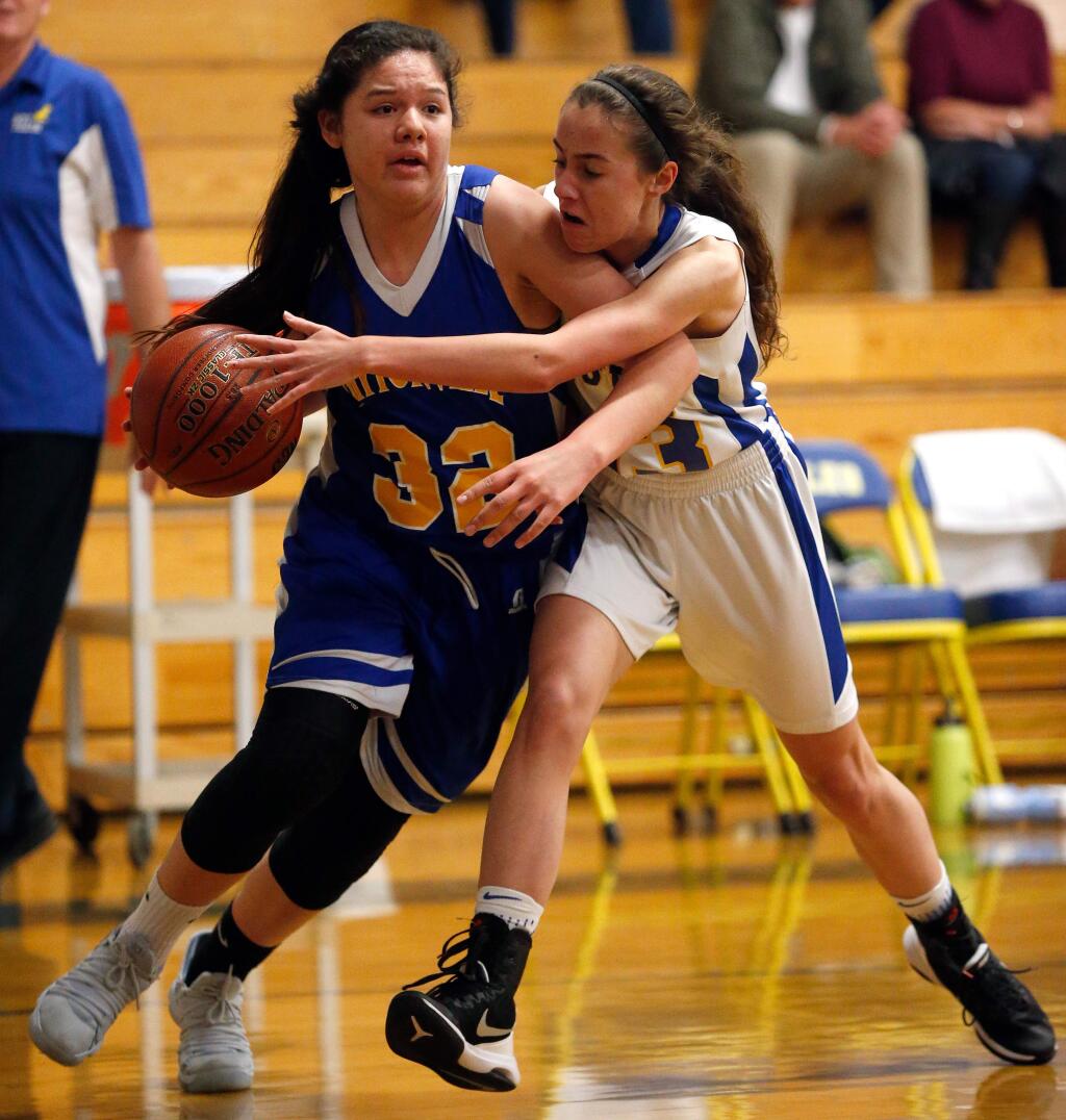 Laytonville's Akeela James, left, drives toward the basket while Rincon Valley Christian's Anika Ahlstrom defends during the first half of the NCS Division 6 championship game in Santa Rosa on Saturday, March 3, 2018. (Alvin Jornada / The Press Democrat)