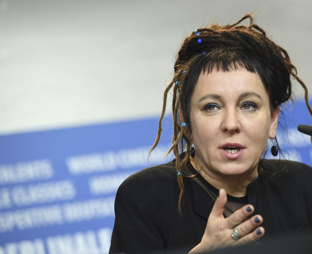 FILE -- In this Feb. 12, 2017 photo Polish author Olga Tokarczuk spekas during a press conference in Berlin, Germany. Olga Tokarczuk is named recipient of the 2018 Nobel Prize in Literature, Thursday Oct. 10, 2019. Two Nobel Prizes in literature are announced Thursday after the 2018 literature award was postponed following sex abuse allegations that rocked the Swedish Academy at that time. (Britta Pedersen/dpa via AP)