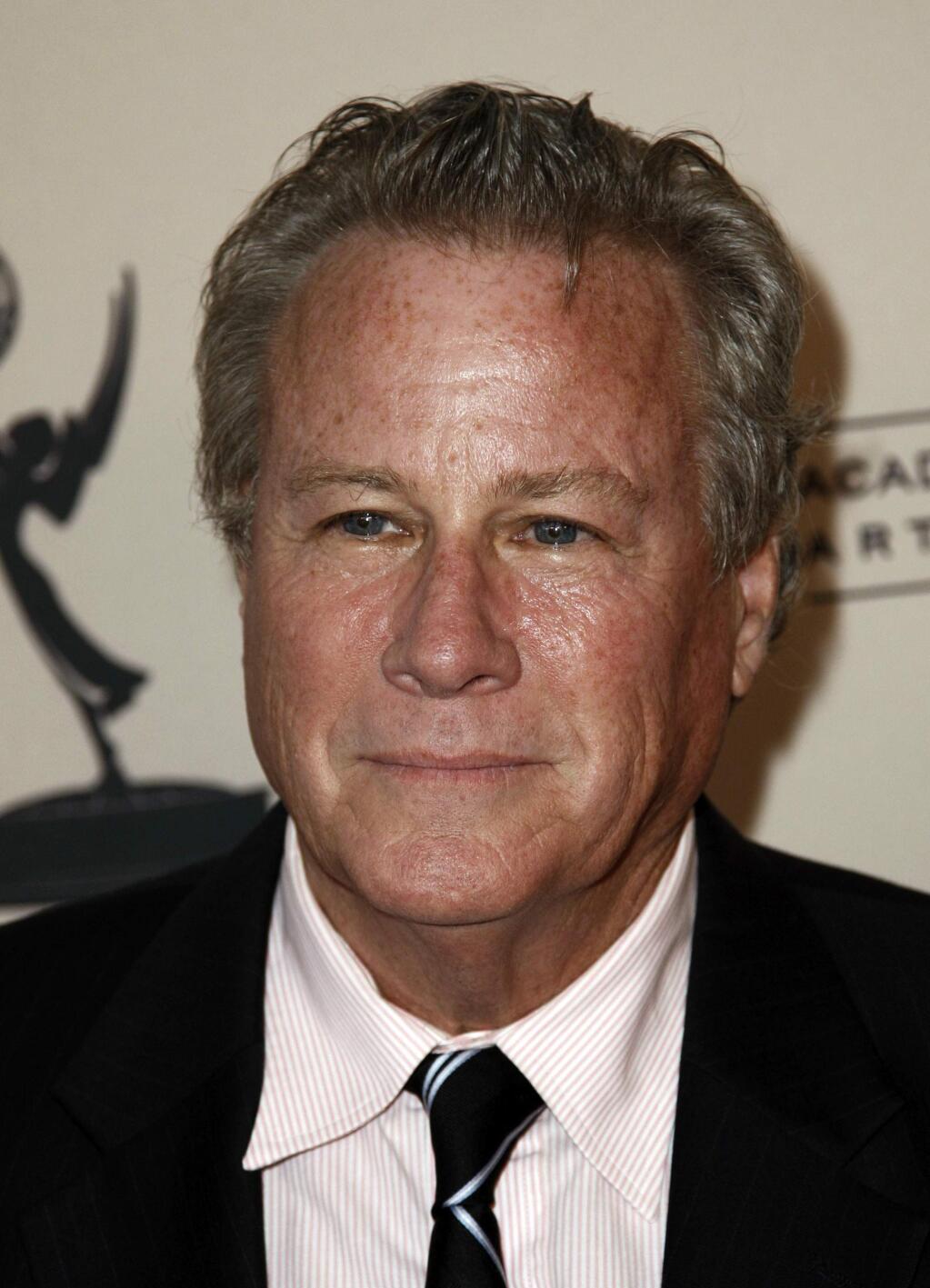 FILE - In this Sept. 12, 2011 file photo, actor John Heard arrives at Academy of Television Arts and Sciences Producers Peer Group celebration of the 63rd Primetime Emmy Awards in Los Angeles. Heard, best known for playing the father in the “Home Alone” movie series, has died. He was 72. His death was confirmed by the Santa Clara Medical Examiner's office in California on Saturday, July 22, 2017. (AP Photo/Matt Sayles)
