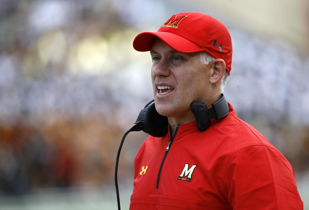 In this Saturday, Sept. 9, 2017, file photo, Maryland head coach DJ Durkin stands on the sideline during a game against Towson in College Park, Md. (AP Photo/Patrick Semansky, File)