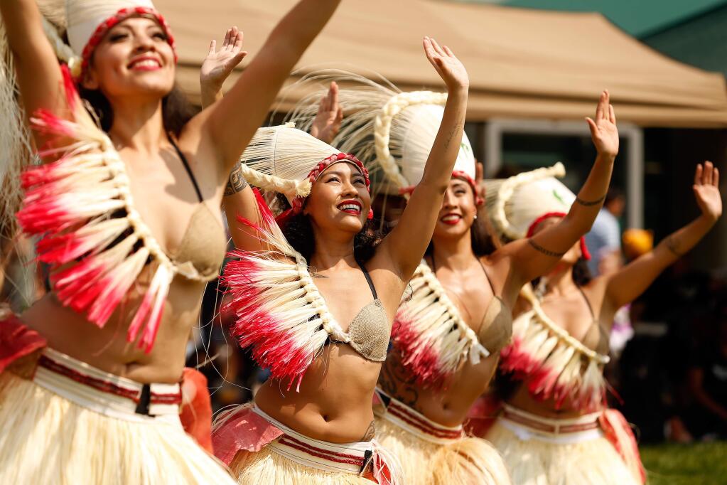 Members of the O Hina'aro Nui School of Tahitian Dance in Brisbane perform during the eighth annual Pacific Islander Festival at City Center Plaza in Rohnert Park, California, on Saturday, August 25, 2018. (Alvin Jornada / The Press Democrat)