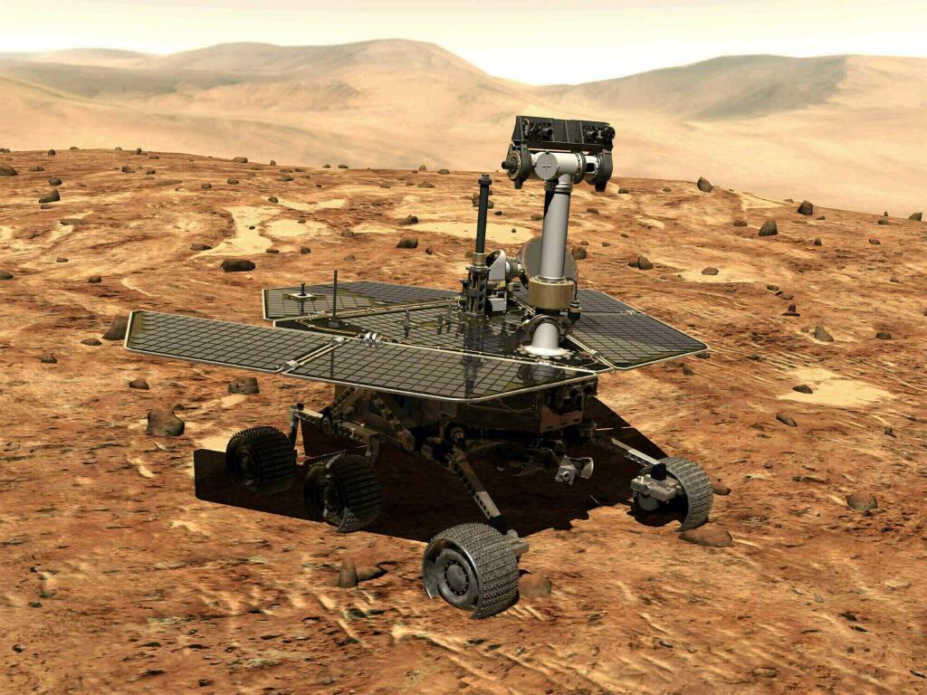 FILE - This illustration made available by NASA shows the rover Opportunity on the surface of Mars. The exploratory vehicle landed on Jan. 24, 2004, and logged more than 28 miles (45 kilometers) before falling silent during a global dust storm in June 2018. There was so much dust in the Martian atmosphere that sunlight could not reach Opportunity's solar panels for power generation. (NASA via AP)