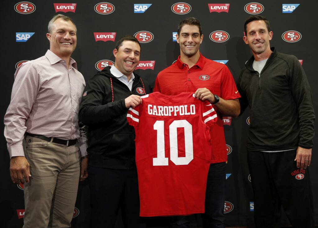 San Francisco 49ers general manager John Lynch, from left, CEO Jed York, newly acquired quarterback Jimmy Garoppolo and head coach Kyle Shanahan pose for a photo during a news conference on Tuesday, Oct. 31, 2017, in Santa Clara. The 49ers traded a second-round pick to the New England Patriots for quarterback Jimmy Garoppolo. (Santiago Mejia/San Francisco Chronicle via AP)