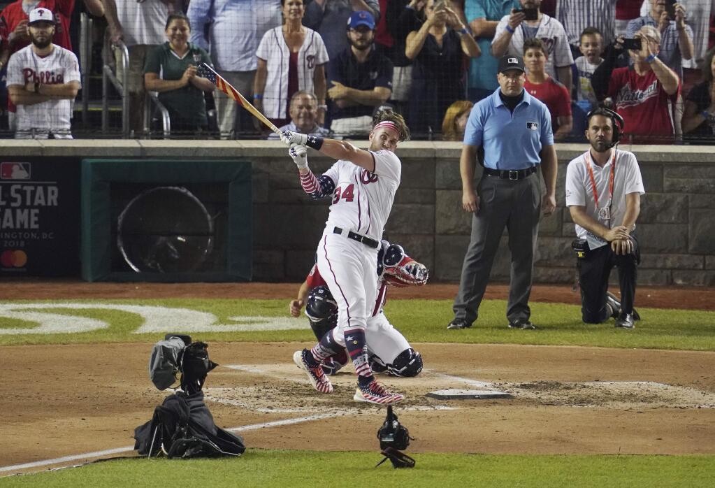 Washington Nationals' Bryce Harper hits the winning home run during the Major League Baseball Home Run Derby, Monday, July 16, 2018 in Washington. The 89th MLB baseball All-Star Game will be played Tuesday. (AP Photo/Carolyn Kaster)