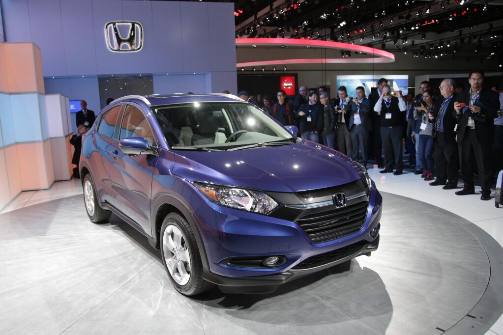 FILE - In this Nov. 19, 2014 file photo, the 2016 Honda HR-V crossover is unveiled at the Los Angeles Auto Show, in Los Angeles. U.S. auto sales were stronger than expected in May, boosted by Memorial Day promotions and strong demand for new SUVs. Honda sold more than 6,300 HR-Vs in the first two weeks it was on sale. (AP Photo/Jae C. Hong, File)