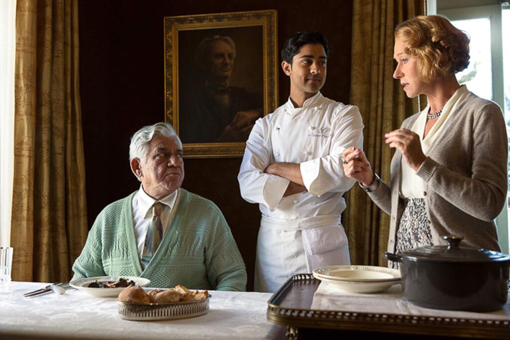 Francois Duhamel / DreamworksIn 'The Hundred-Foot Journey,' Hassan (Manish Dayal), center) serves his father (Om Puri) Beef Bourguinon á la Hassan, a classic French dish with an Indian twist, as Madame Mallory (Helen Mirren) explains its significance to French chefs.