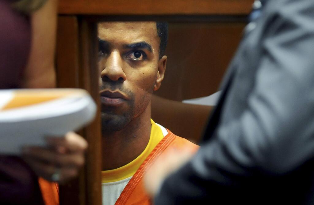 FILE - In this March 14, 2014, file photo, Darren Sharper appears in Los Angeles Superior Court in Los Angeles. Former NFL star Darren Sharper has been sentenced to 18 years in prison in a case where he was accused of drugging and raping as many as 16 women in four states. Judge Jane Triche Milazzo sentenced Sharper on Thursday, Aug. 18, 2016, in New Orleans. (AP Photo/Los Angeles Times, Wally Skalij, Pool, File