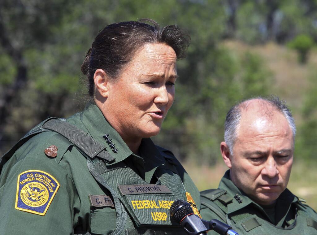 FILE - In this April 26, 2018, file photo, U.S. Border Patrol Acting Chief Carla L. Provost, left, meets with members of the media south of Falfurrias, Texas. Immigration authorities detain and process thousands of people every month who cross the U.S. border without permission. But when detained people try to make claims of misconduct, advocates say they run into a series of hurdles and issues that make their complaints difficult to substantiate. Border Patrol chief Provost said in a recent interview that her agency takes any allegations against any of its 19,000 agents 'very, very seriously.' (Joel Martinez/The Monitor via AP File)