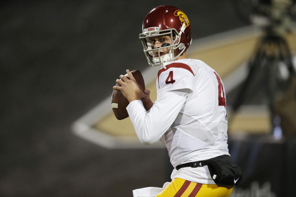In this Nov. 13, 2015, file photo, Southern California quarterback Max Browne warms up before the first half of a game in Boulder, Colo. (AP Photo/David Zalubowski, File)