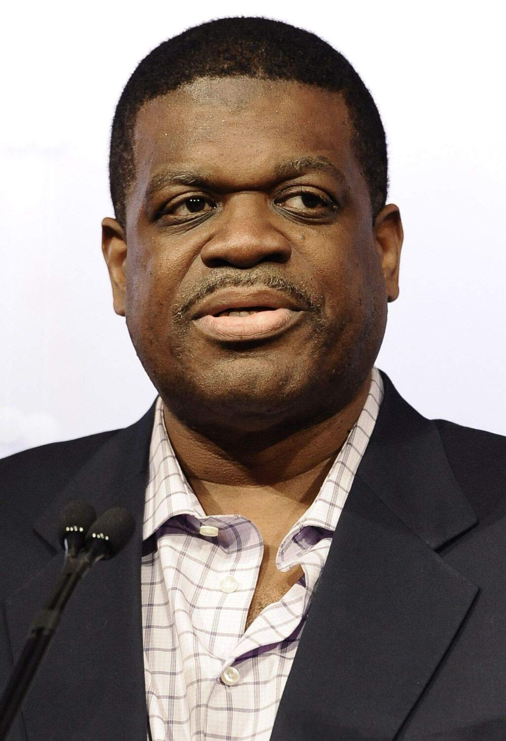 Bernard King, a member of the 2013 class of inductees into the Basketball Hall of Fame, smiles during a news conference at the Naismith Memorial Basketball Hall of Fame in Springfield, Mass., Saturday, Sept. 7, 2013.(AP Photo/Jessica Hill)