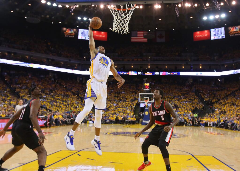 Golden State Warriors forward Andre Iguodala goes up for a dunk against the Portland Trailblazers during Game 2 of the first round of NBA playoffs in Oakland on Wednesday, April 19, 2017. (Christopher Chung/ The Press Democrat)