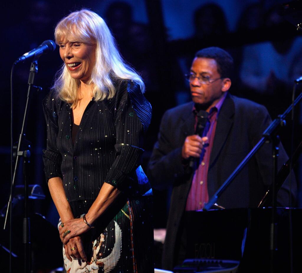 FILE - This March 20, 2008 file photo shows Joni Mitchell, left, and Herbie Hancock perform as part of Nissan Live Sets on Yahoo! Music in Los Angeles. A Los Angeles judge on Monday, May 4, 2015, appointed Mitchell's longtime friend Leslie Morris as the Grammy winner's temporary conservator, giving her emergency powers to make health care and lifestyle decisions. The ruling came after Morris' attorney told a judge that Mitchell may be released from a hospital in the next few days. (AP Photo/Mark Mainz, File)