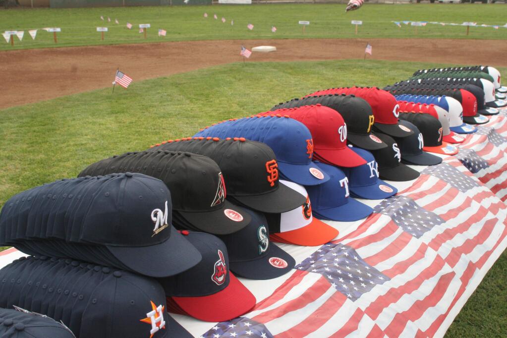 Team caps lined up for this year's Sonoma Little Leaguers before the Opening Day Ceremony, held Friday, March 17, at Hughes Field. (Christian Kallen/Index-Tribune)