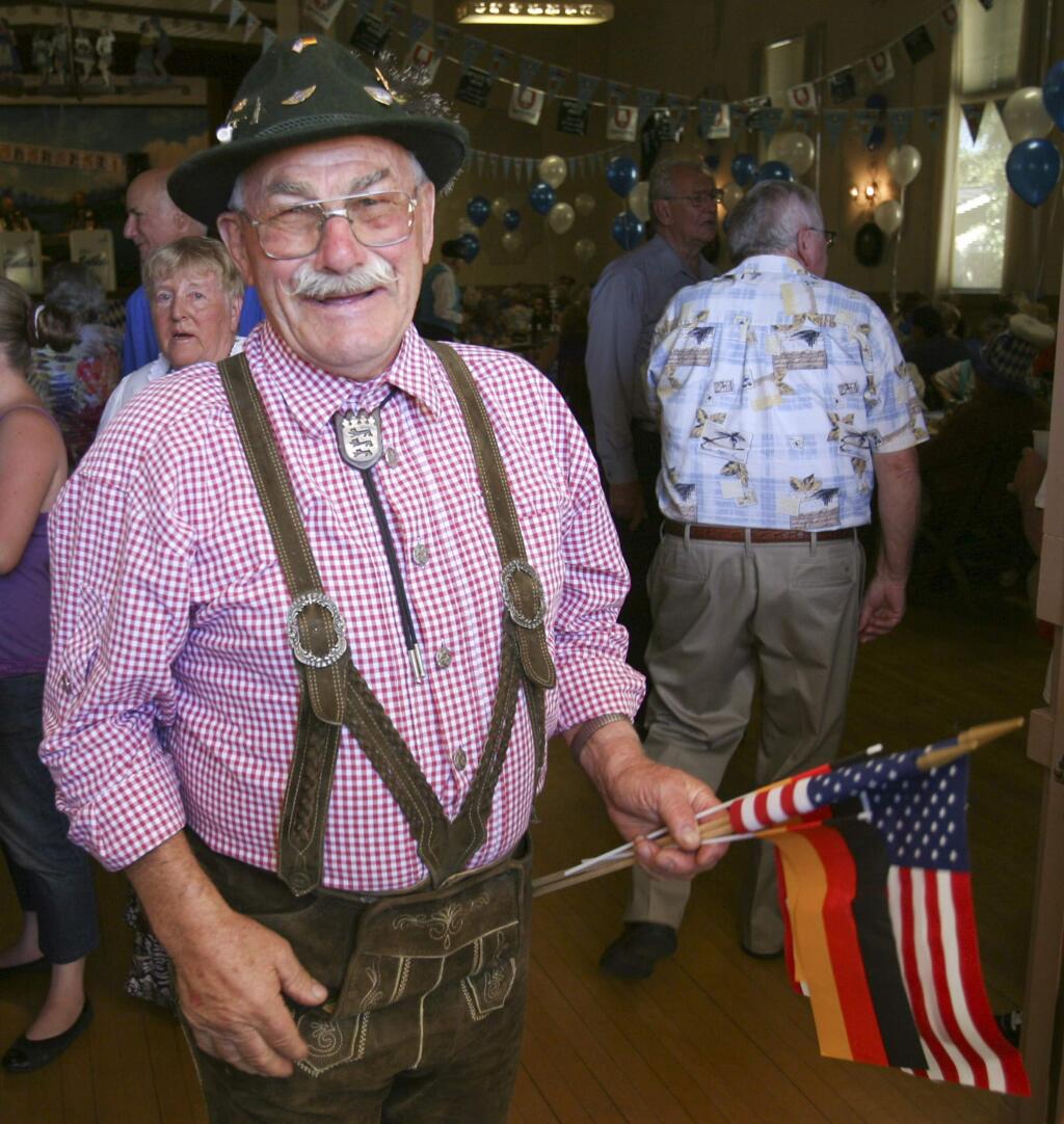 Manfred Gruener organizing the Entry of the flags at the front door at the Oktoberfest at Hermann Sons Hall on Sunday October 12, 2014. (SCOTT MANCHESTER/ARGUS-COURIER STAFF)