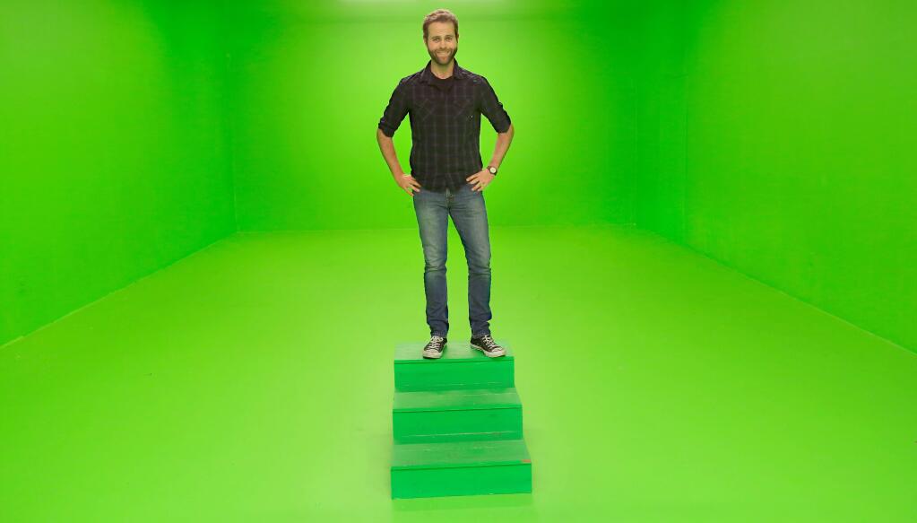 Producer Daniel Sullivan of Northbay Television in a newly painted green screen room, Wednesday, Dec. 17, 2014. Sullivan, along with others, produce an internet series called 'House On The Hill,' under the name of Crowhaven Productions. (KENT PORTER/ PD)