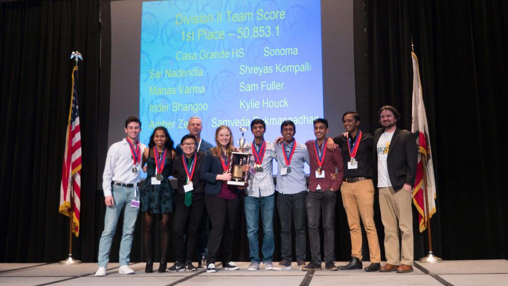SCOTT WIGERT PHOTOMembers of the Casa Grande High School Academic Decathlon team take the stage in Sacramento after winning their division in the State Championship competition.
