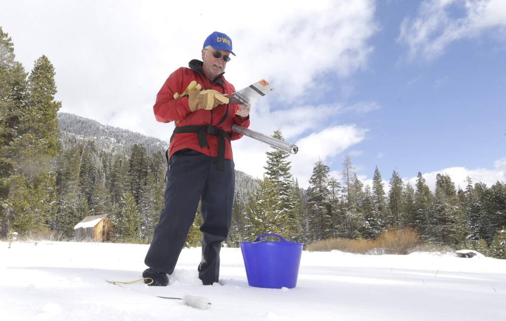 Frank Gehrke, chief of the California Cooperative Snow Surveys Program for the Department of Water Resources, records the results of the third snow survey of the season held near Echo Summit, Calif., Tuesday March 3, 2015. While a recent snow storm fell in the area, the snow survey showed the snow pack to be only .9 inches deep, with a water content of 6.9 inches, which is 5 percent of normal for this site at this time of year. (AP Photo/Rich Pedroncelli)