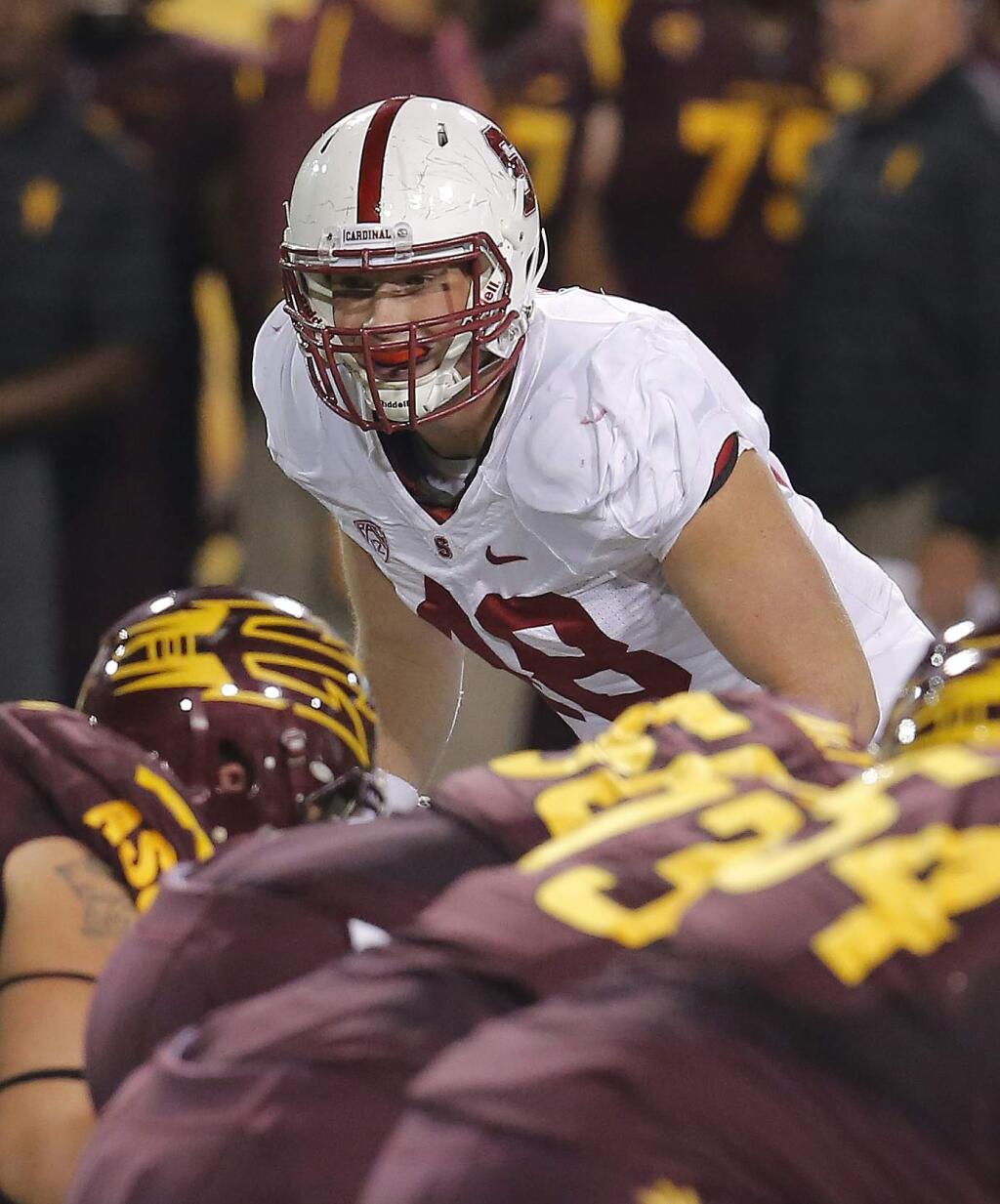 FILE - In this Oct. 18, 2014, file photo, Stanford linebacker Kevin Anderson (48) lines up during the second half of the NCAA college football game against Arizona State in Tempe, Ariz. After a down season a year ago, Stanford hopes to get back to the top of the Pac-12. (AP Photo/Rick Scuteri, File)