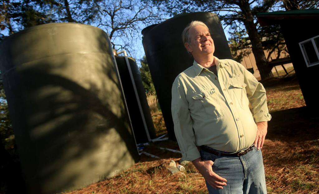 Karl Anderson at his Bodega home where he built a rainwater catchment system, complete with 15,000 gallon water tanks, Wednesday Dec. 23, 2015. (Kent Porter / Press Democrat ) 2015
