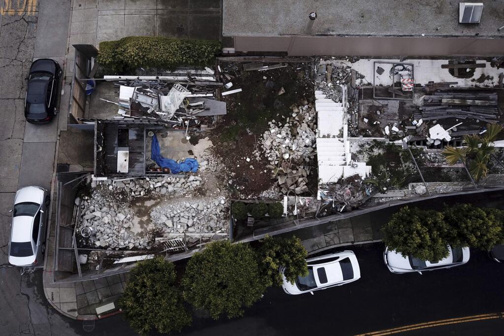 This Friday, Dec. 14, 2018, photo shows an aerial view of a demolished house in San Francisco. A man who illegally demolished the San Francisco house designed by the modernist architect Richard Neutra was ordered this week to rebuild it exactly as it was. The city Planning Commission also ordered Ross Johnston to add a sidewalk plaque telling the entire saga of the house's origins in the 1930s, its demolition and replication. (Santiago Mejia//San Francisco Chronicle via AP)